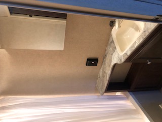 Travel trailer equipped with a wash basin, visible on the interior of the trailer